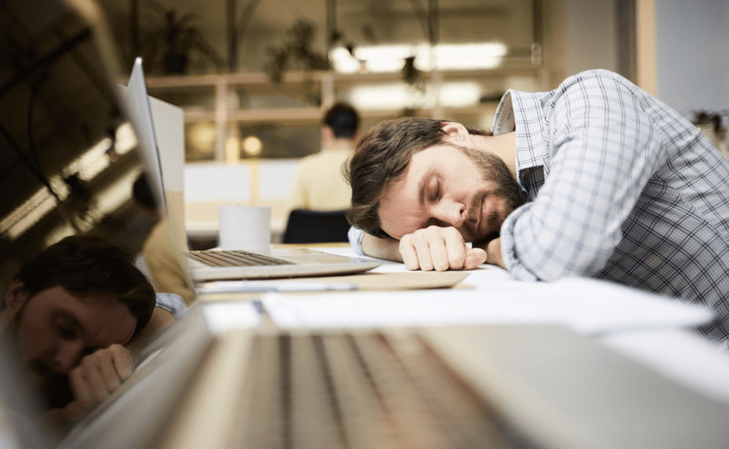 Working looking tired desk 