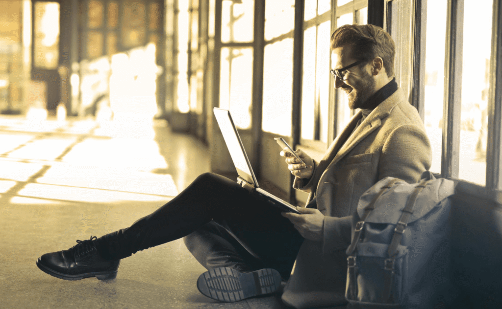 man checking phone while workingman checking phone while working