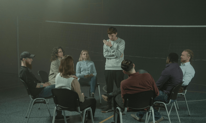 man overthinking during group discussion