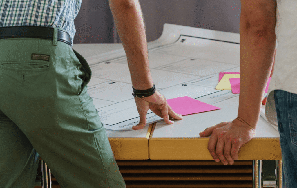 man looking at reflection thinking serious