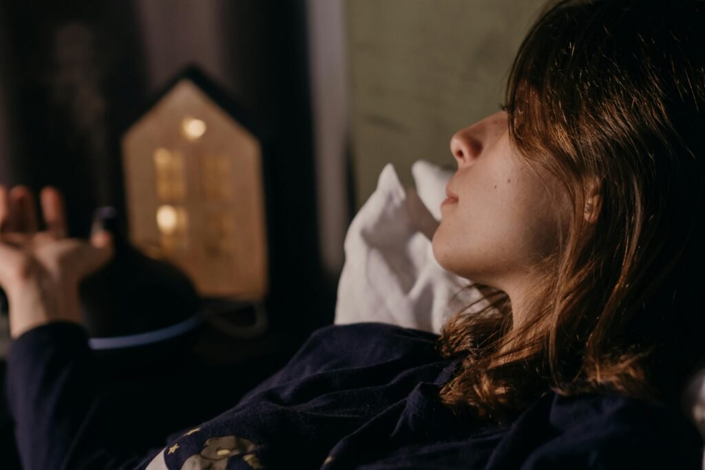 woman dim light relaxing before sleep