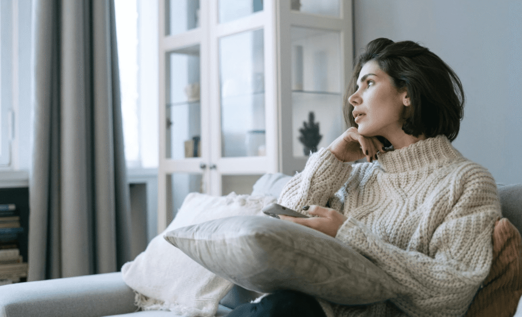 woman sitting alone calm at home