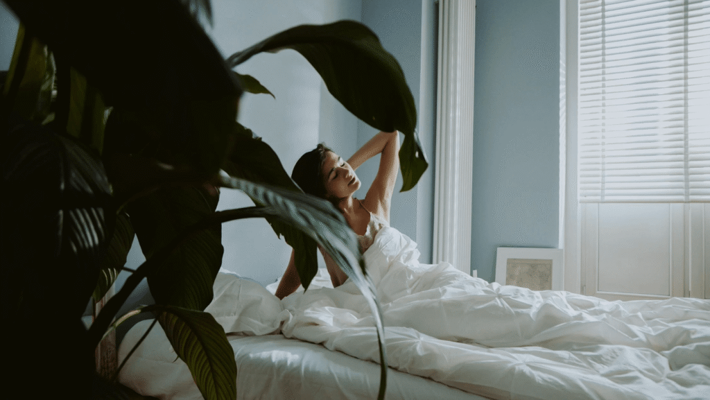 woman waking up tired messy bed morning